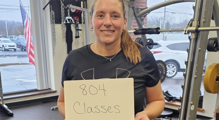 Member holding a sign that says 804 classes