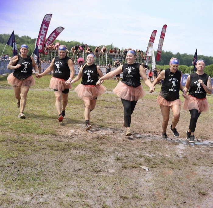 The Dirty Divas team running a mud run