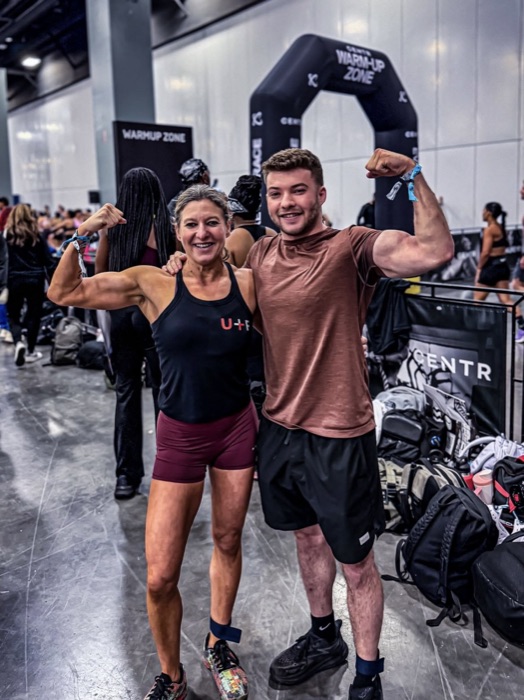 Member flexing in the warmup zone at a competition